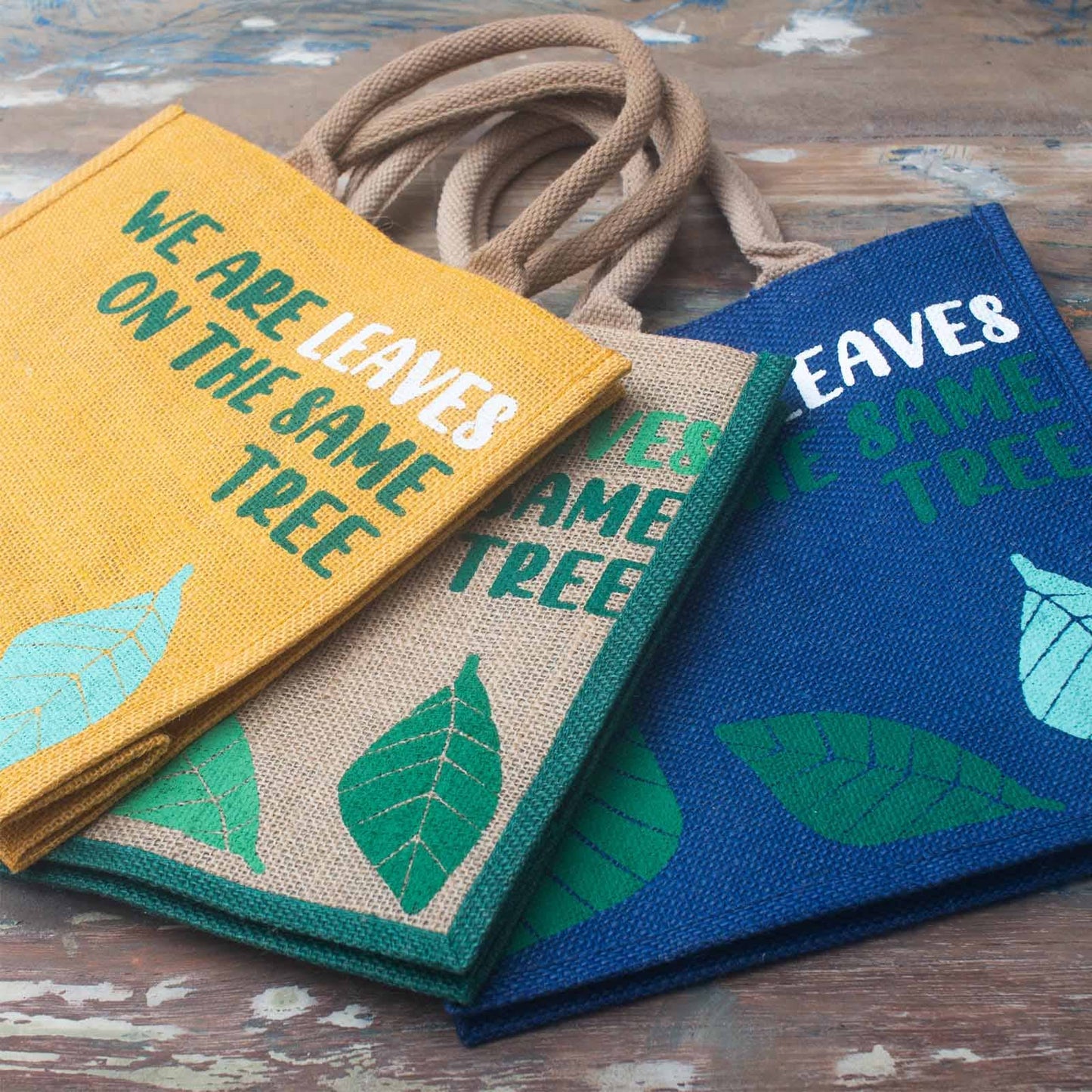 Set of 3 "We are Leaves on the Same Tree" Printed Jute Bags