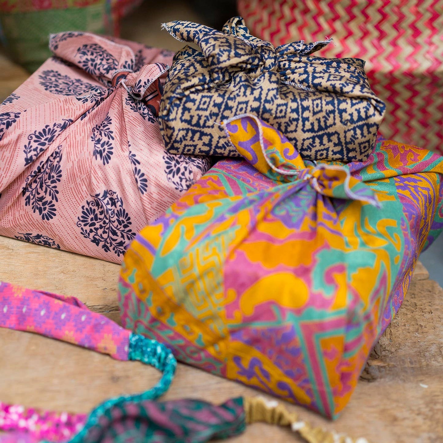 Colorful fabric-wrapped packages on a wooden surface